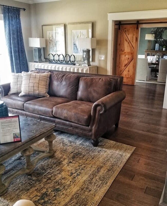 Residential area rug and wood flooring in Franklin, KY from Shop at Home Carpets