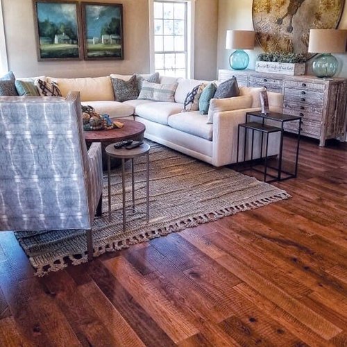 Living room hardwood flooring with an area rug in Glasgow, KY from Shop at Home Carpets