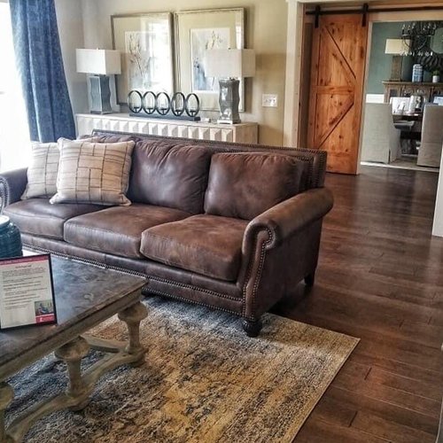 Residential area rug and wood flooring in Franklin, KY from Shop at Home Carpets