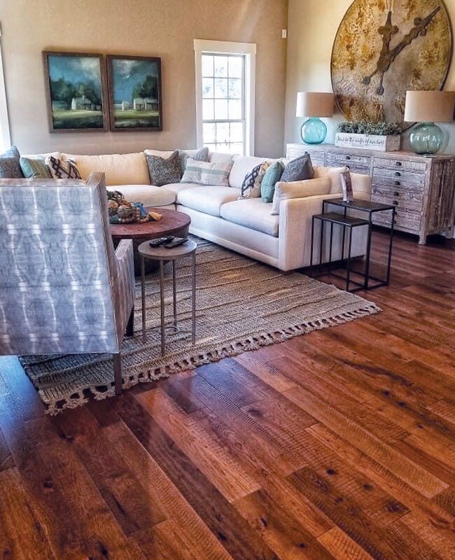 Living room hardwood flooring with an area rug in Glasgow, KY from Shop at Home Carpets
