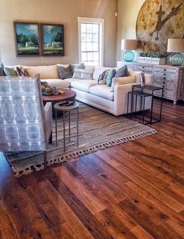 Living room hardwood flooring with an area rug in Glasgow, KY from Shop at Home Carpets